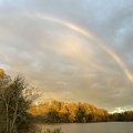 rainbow over swimming river